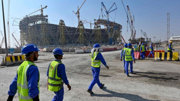 Arbeidere bygget stadion i Qatar. Foto: AFP